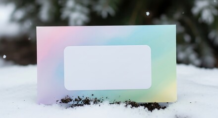 Pastel card in snow with blank label for personalized message.