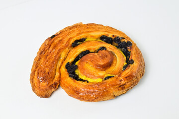 Close up view of raisin roll isolated on white background. Clipping path. Fresh, brown.