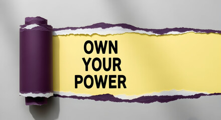 Own your power message revealed with torn paper, creating a vibrant and bold statement with positive energy for empowerment campaigns