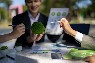 Business people discussing esg sustainability in outdoor meeting