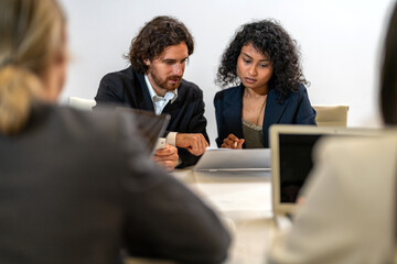 Diverse tech team meeting on software project, mentor guiding coworker on laptop, teamwork development using collaboration tools, modern technology, app design, dev training and enterprise SaaS team
