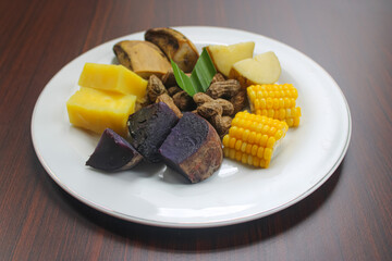 Indonesian Boiled Roots, Corn, and Peanuts on Wood