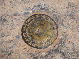 First Order Survey Control marker on Cahuenga Peak at Wisdom Tree in Los Angeles, California, USA