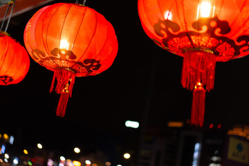 Traditional Red Chinese Lanterns Glowing Brightly at Night Festival