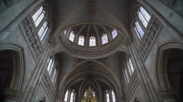 Majestic Cathedral Interior with Vaulted Ceilings and Dome.