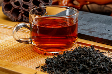 Pre-brewed Pu-erh black tea served in a high-quality white porcelain tea set