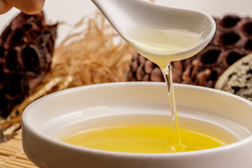 High-quality flaxseed oil in a vessel against a complex background