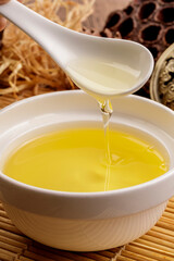 High-quality flaxseed oil in a vessel against a complex background