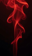 Obraz premium Abstract red smoke texture on black background, soft swirling lines creating moody dark energy effect. 