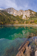 Long Lake in autumn in Jiuzhaigou National Park is a famous lake with crystal clear water and beautiful mountain backdrop. Sichuan, China