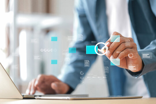 Document management system , Businessman  manage documents online compare statistical data and data checklist , smart system before final task delivery. DMS concept