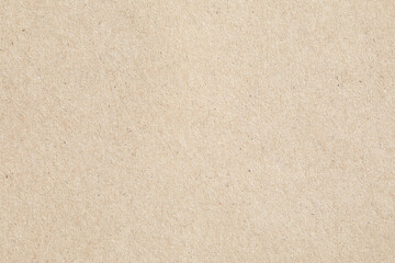 Macro closeup of beige paper kraft fibrous texture