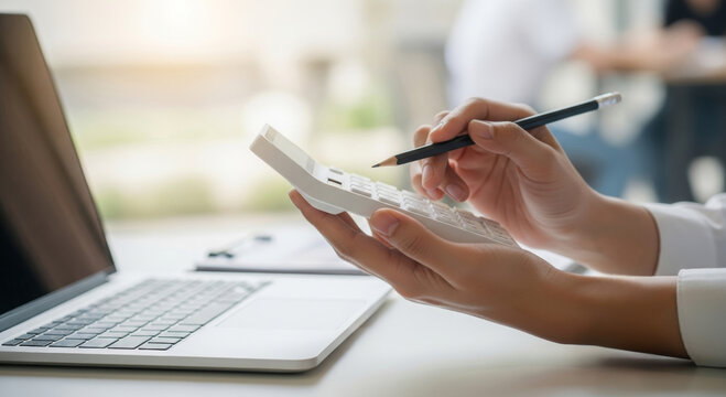 Finance report analyst tax budget financial accounting professional calculating figures on calculator with laptop on desk focused office planning and thoughtful expression