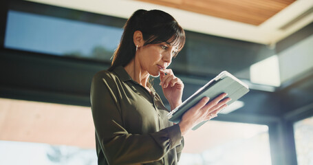 Thinking, business and woman with tablet, below and news agency with planning for column. Mature...
