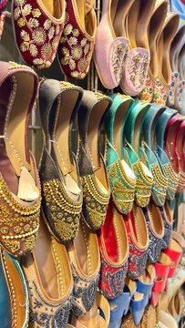 These vibrant, handcrafted traditional Indian juttis feature intricate embroidery and embellishments, perfect for adding a touch of ethnic elegance to any outfit. Originating from North India, these u