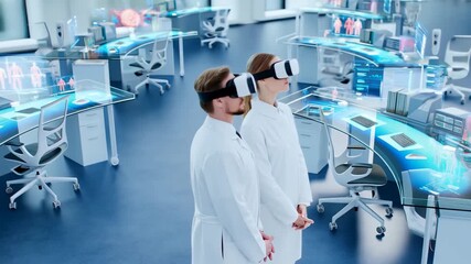Male and female scientists wearing virtual reality headsets exploring digital medical data visualization and holographic human organ models in a futuristic lab, video - Powered by Adobe