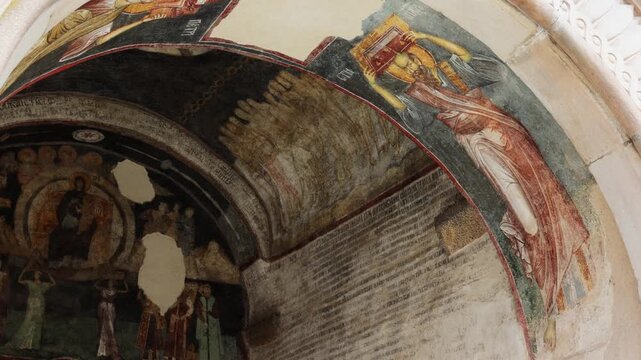 Orthodox fresco in Zica Monastery, Serbia. Saint carries the symbol of the church. Travel to historical places of Europe. High quality 4k footage