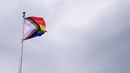 LGBT community. Tolerance and equality. World gay pride. Rainbow gay flag. Pride month. LGBTQ rainbow flag. LGBT rainbow flag waving against sky. Symbol of pride and LGBTQ. Colorful pride flag