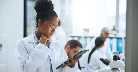 Scientist, think and woman with tablet in laboratory for development, medical research or...