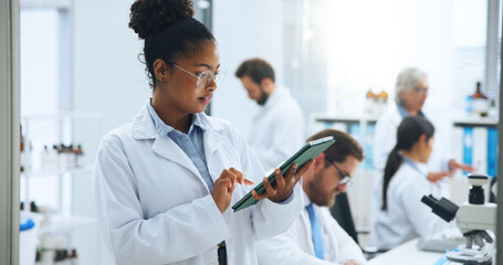 Scientist, woman and tablet in laboratory for development, medical research or innovation. Science, technology and person with experiment report, pharmaceutical review or study with test feedback