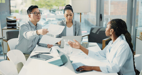 Business people, meeting and documents with laptop for collaboration, team project or statistics. Group, employees or passing paperwork with computer for corporate performance review in workplace