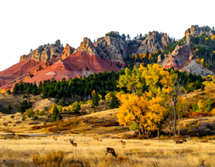 A vibrant autumnal scene of mountains, a meadow with deer grazing, and trees in colorful foliage. The landscape is lit by golden sunlight