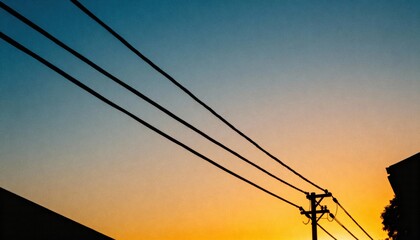 Lines of Power: The silhouette of power lines elegantly divides a vibrant sky at sunset, creating a juxtaposition of industrial design and natural beauty.