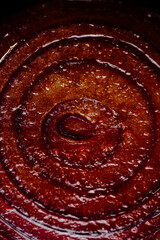 Breakfast with fried eggs, grilled tomato, mushrooms and beans on dark plate