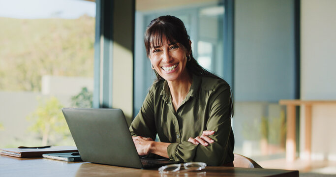 Portrait, laptop and happy business woman in office as hr manager, talent acquisition and about us. Smile, mature person and confident worker with computer, hiring expert and arms crossed in Canada