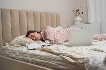 school, education and laziness concept - tired teenage student girl with notebooks sleeping on bed at home