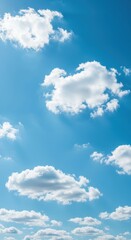 Naklejka premium A beautiful, vast expanse of bright blue sky filled with scattered white, fluffy clouds on a sunny, perfect day ,stratus ,cloud ,serenity