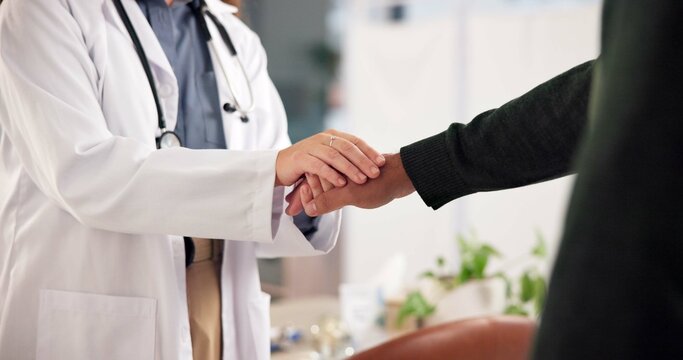 Doctor, patient or holding hands in office with empathy for healthcare checkup, test results or advice. Medical professional, people or support with compassion for consultation, diagnosis or feedback - Powered by Adobe