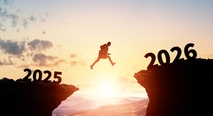 Businessman jumping from 2025 to 2026. 2026 New Year concept. New year's card 2026.