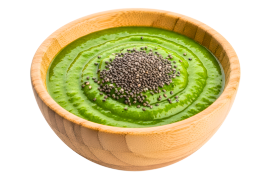 Healthy green smoothie in a wooden bowl topped with chia seeds isolated on transparent background