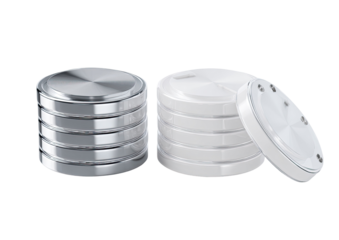 Two stacks of metal disks, one silver, one white, with a loose top disk near the white