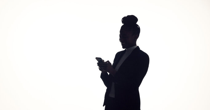 Texting, silhouette and businesswoman in studio with phone, online communication or feedback on email. Space, digital or employee on white background with tech, networking or message update on app