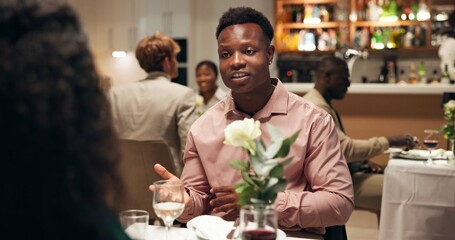 Couple, date and conversation in restaurant with wine for romance, anniversary celebration and love. Hospitality, talk and fine dining with man, woman and smile with diner discussion and bonding