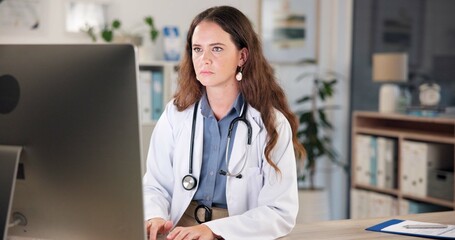 Night, doctor and woman in office, computer and online reading with research for medicare. Person,...