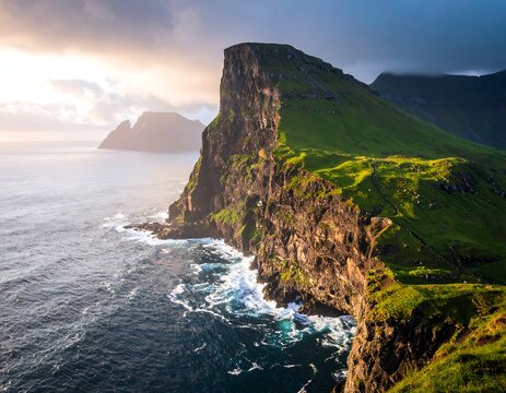 Scenic coastal landscape featuring a high cliff face and ocean water