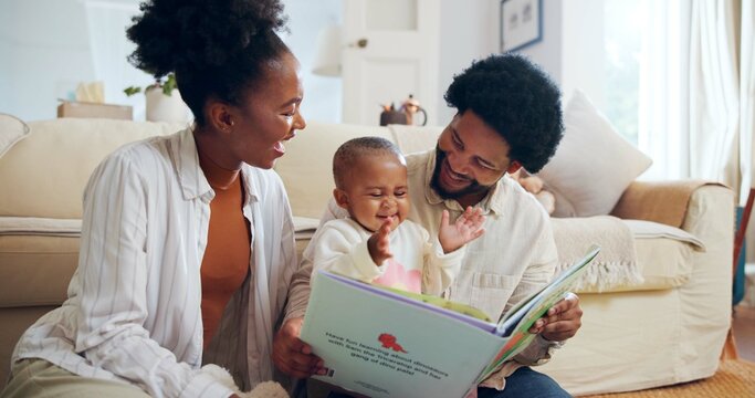 Happy, black family and reading book with child in home for story, bonding or childhood development. Mom, dad and toddler with kids novel, dinosaur or smile for learning or fantasy together in house - Powered by Adobe