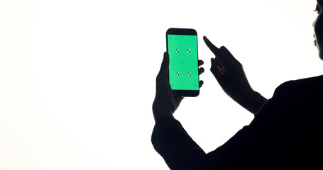 Phone, green screen and woman in studio with networking, communication or social media on mobile app. Cellphone, space and female person with technology for contact with email by white background.