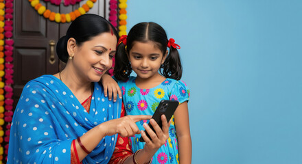 Indian Mother Daughter Happily Using Smartphone Together