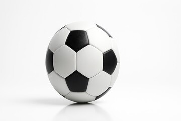 Fototapeta premium Classic black and white soccer ball centered straight on composition with panels aligned on white