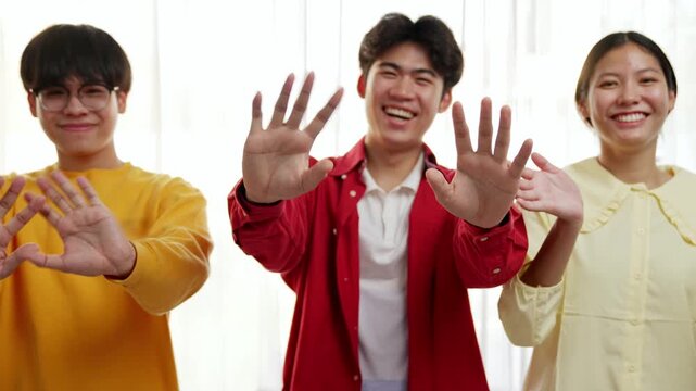 Panoramic video happy asian startup company employee wear colorful casual cloth standing in line together happily wave hand symbolize cheerful teamwork, goodbye coworker, HR agency greeting. Synergic