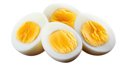 Sliced boiled eggs with yellow yolk and white protein texture showing healthy breakfast food and nutrition detail isolated on white background