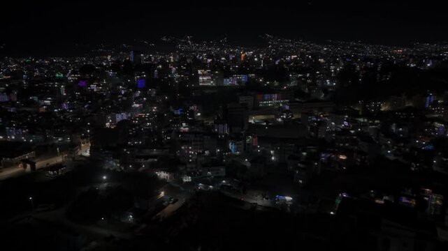 Aerial night footage of Kathmandu city during Diwali (Tihar), featuring the illuminated Dharahara Tower and glowing skyline filled with festive lights, showing Nepal&rsquo;s vibrant cultural celebration.