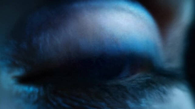 Close-up of a human eye featuring an intricate, electric blue iris