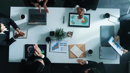 Top down aerial view of diverse business team listening manager present growth sales while giving a high five to encourage or motivate team. Group of people celebrate successful project. Directorate.