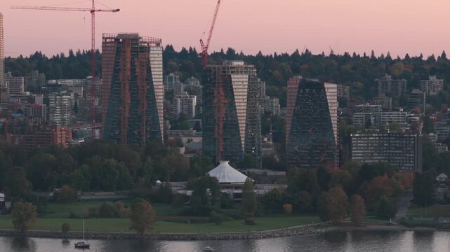 Aerial telephoto panning shot of Vanier Park at sunset in Vancouver, British Columbia, Canada. 4K
