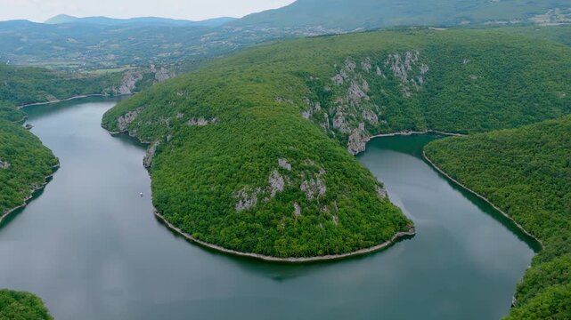 Aerial drone view of the Vrbas River in Bosnia and Herzegovina, flowing through green canyons and rocky cliffs a popular destination for rafting and nature travel